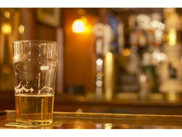 glass of beer on bar counter