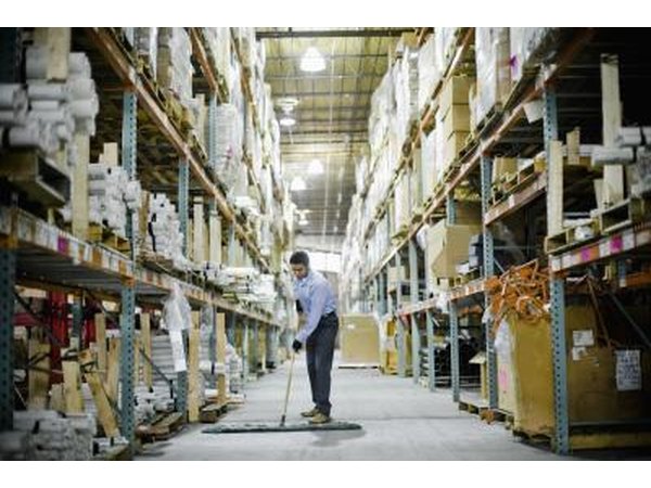 Warehouse worker sweeping