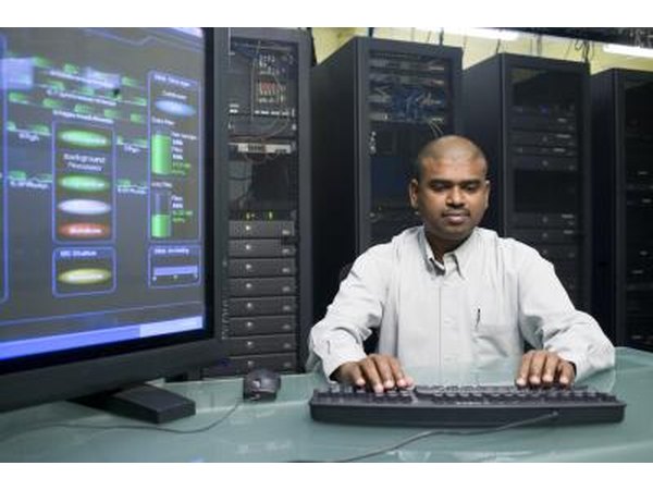Computer technician working in server room