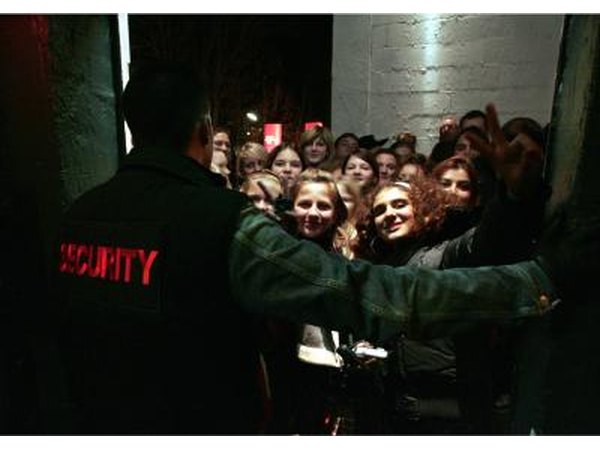 Security regulating line at front of venue