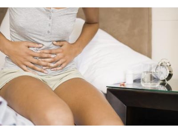 Woman holding stomach