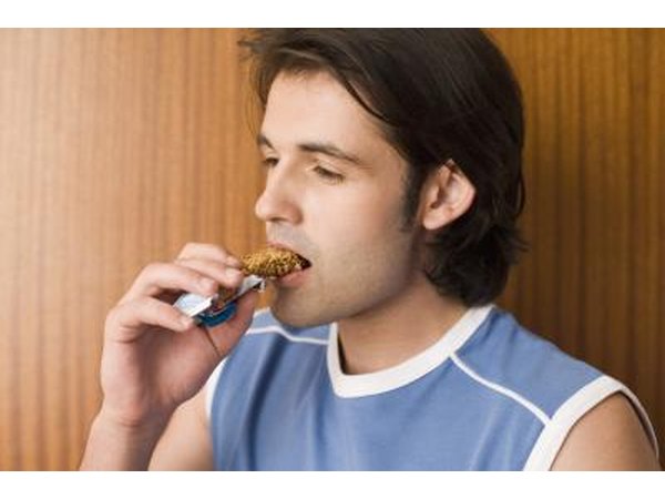 Man eating a granola bar