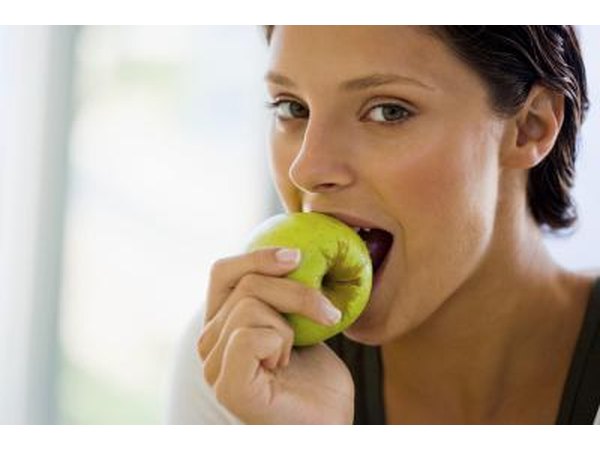Woman eating an apple