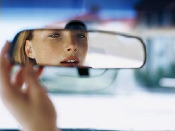 Woman looking in mirror