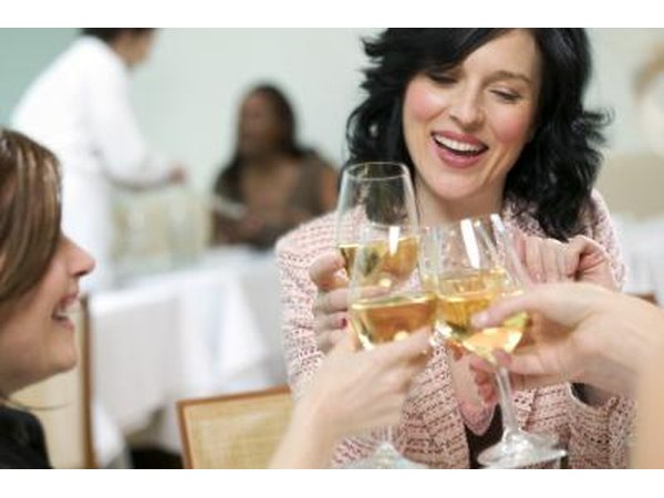 woman drinking white wine