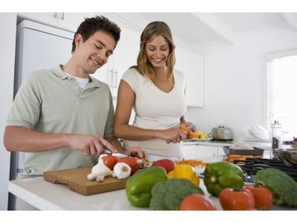 Young couple making food recommended by the Herbalife diet