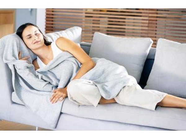 woman on couch with blanket