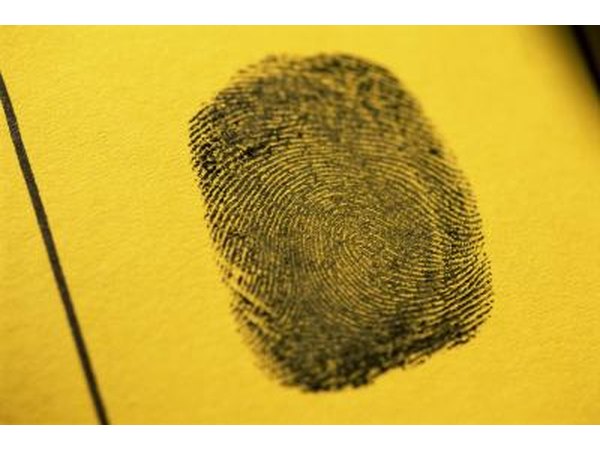 Fingerprint on yellow paper.
