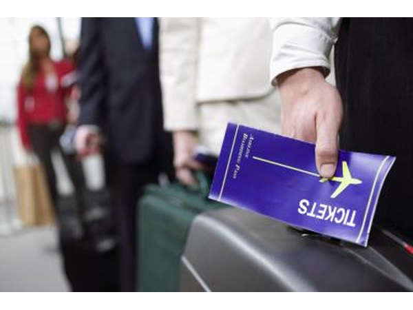 Man holding airplane ticket