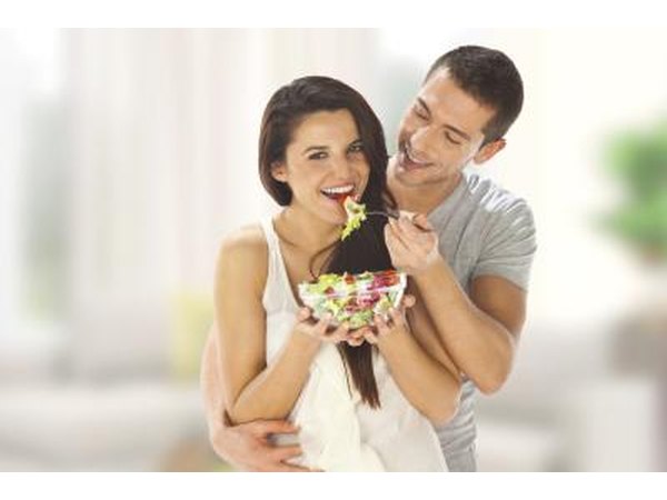 young hipsters eating salad