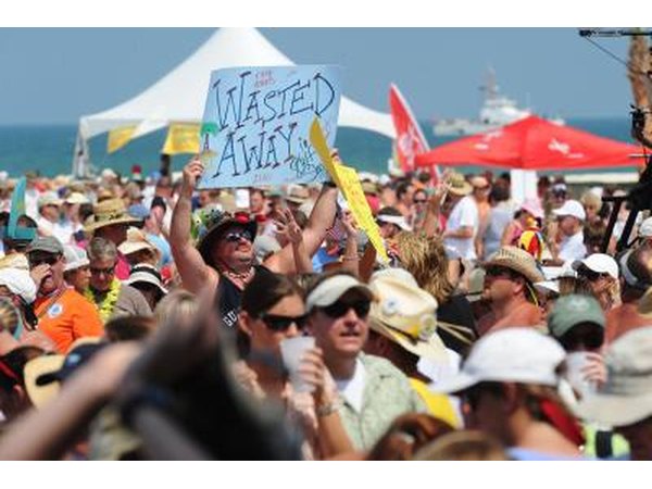 View of crowd at Jimmy Buffett concert at the beach