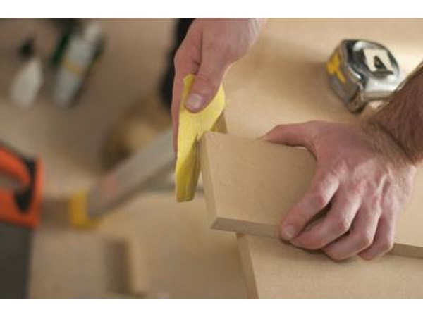 Hand sanding a piece of wood
