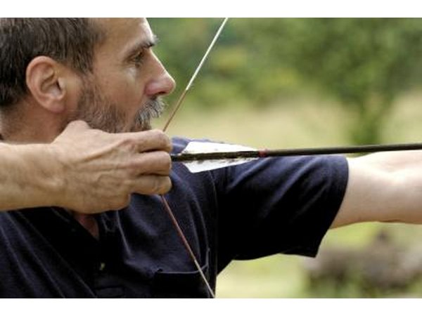 Man aiming bow and arrow