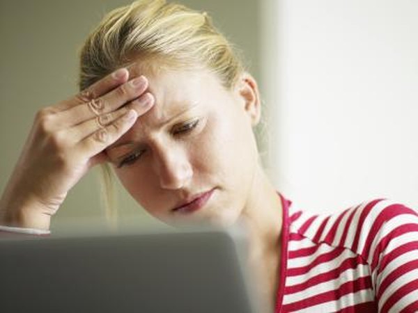 Woman feeling stressed at office
