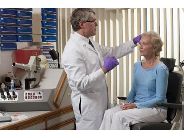 plastic surgeon with patient