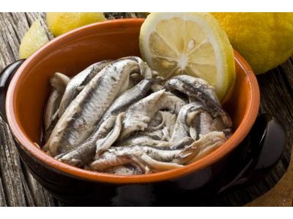 Anchovies with olive oil and lemon in a bowl