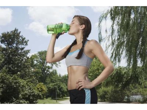 Woman drinking from water bottle