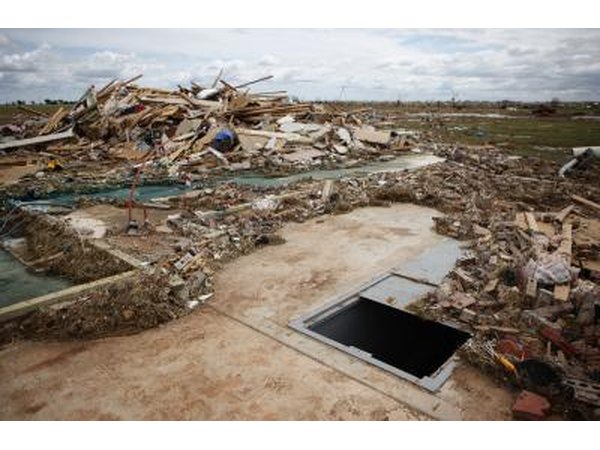 A storm shelter among tornado damage in Piedmont, OK