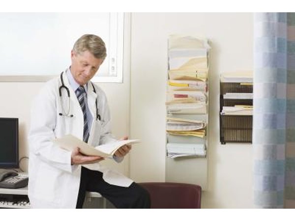 doctor looking at file