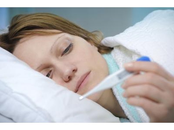 An infection accompanied by a low grade fever may cause tiredness in the legs.