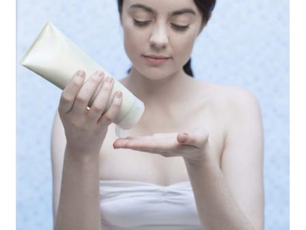 Woman applying lotion