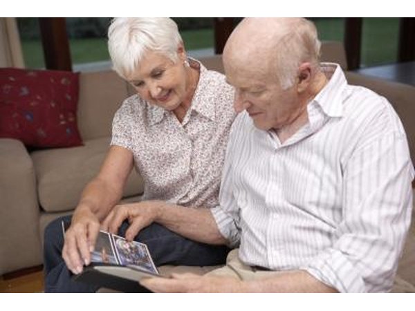 couple looking at photos from reunion