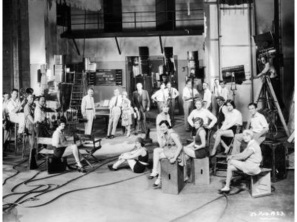 Actors and actresses on set during filming of "The Jazz Singer"