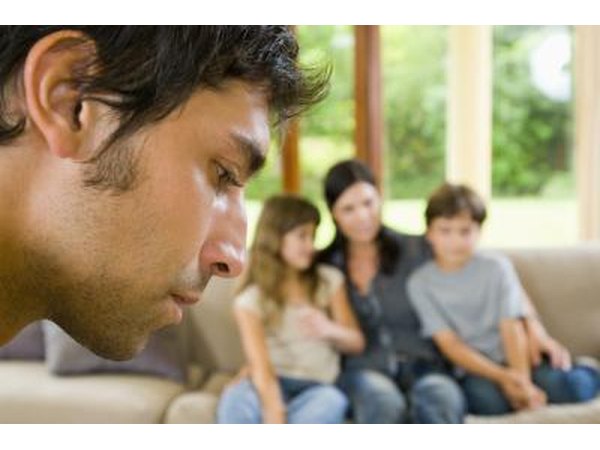 Man looking away from family