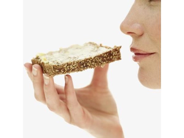 Woman eating wheat bread