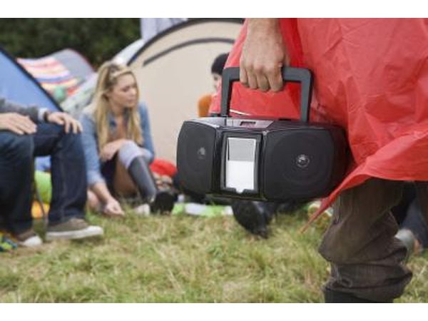 Listening to music through speakers will not cause as much direct damage to your eardrums.