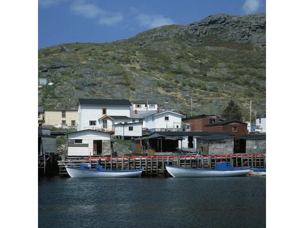 Two docked boats in a coastal fishing town.