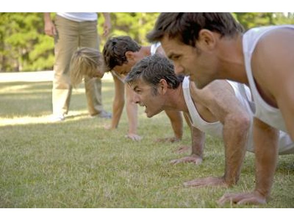 group of people doing pushup's
