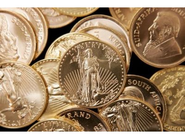 American Eagle gold coin with South African gold coins