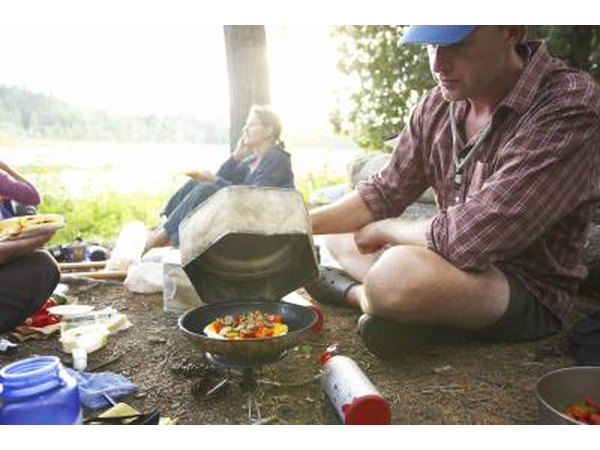 Preparing a meal at a campsite
