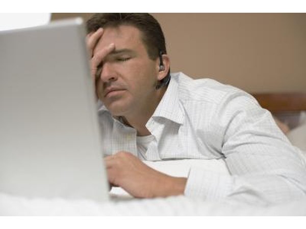 Tired man in front of laptop