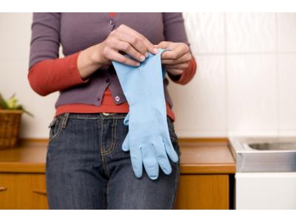 woman holding rubber gloves
