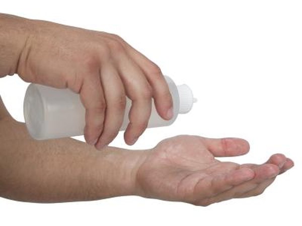 Man putting cream in hands