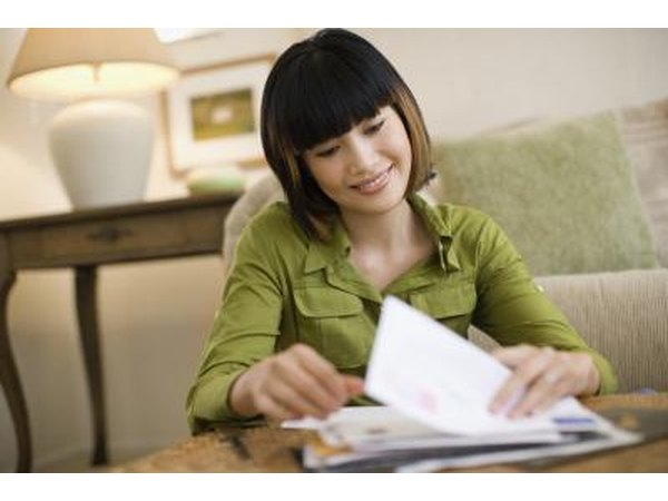 woman looking through mail