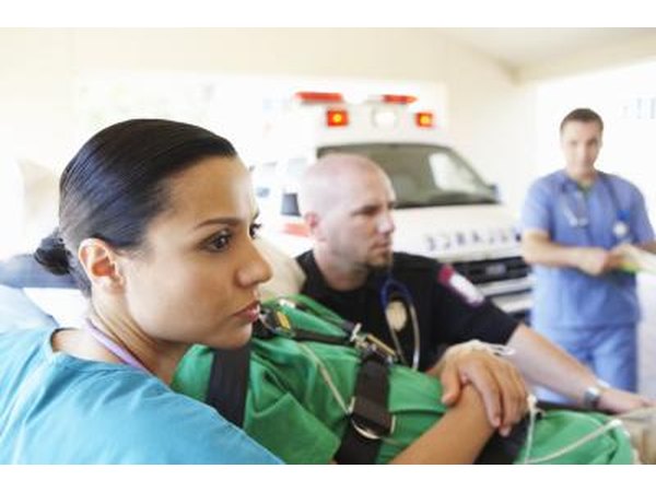 EMTs arrive at an emergency scene and give first aid to those that can't be transported to a hospital unless first treated.