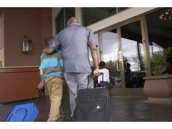 Father and son walking into hotel
