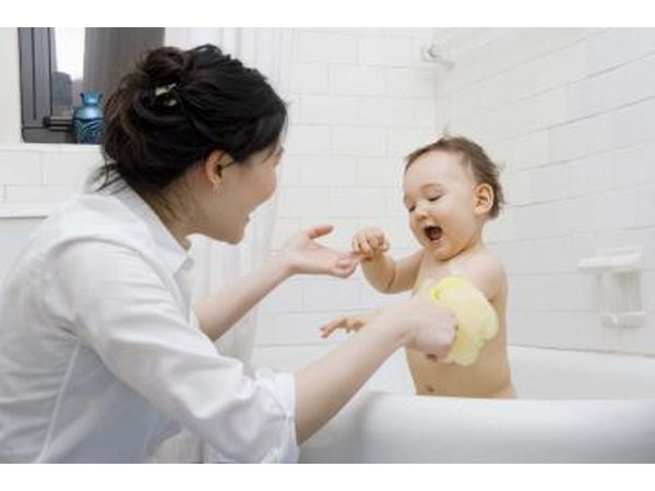 Mother with baby in bath
