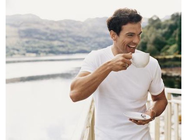 Caffeine causes an increase of dopamine in the brain leading to feelings of happiness.