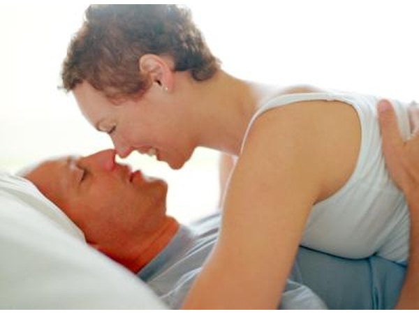 Mature couple embrace in bed