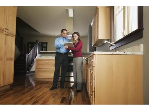 Couple inspecting kitchen