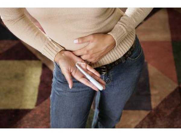 woman holding tampon