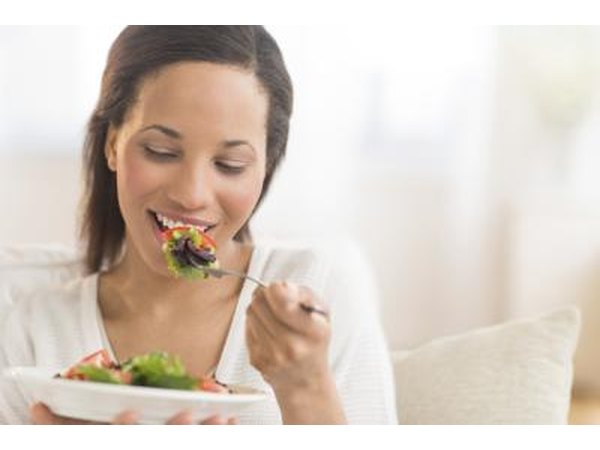 Woman eating salad