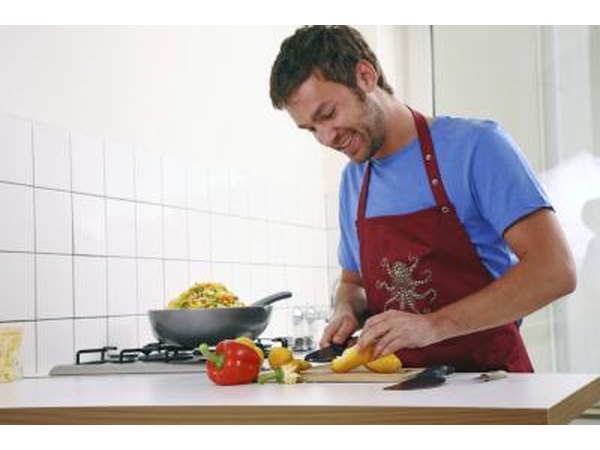 Man slicing peppers