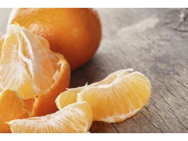 A close-up of a peeled mandarin orange.