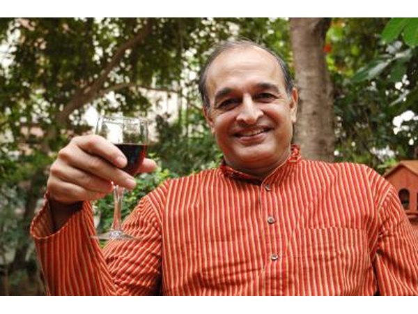 man holding wine glass