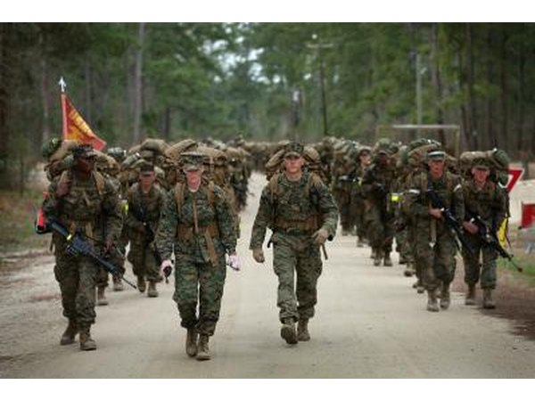 Marines carry 55 lb. packs during Military Training at Camp Lejeune